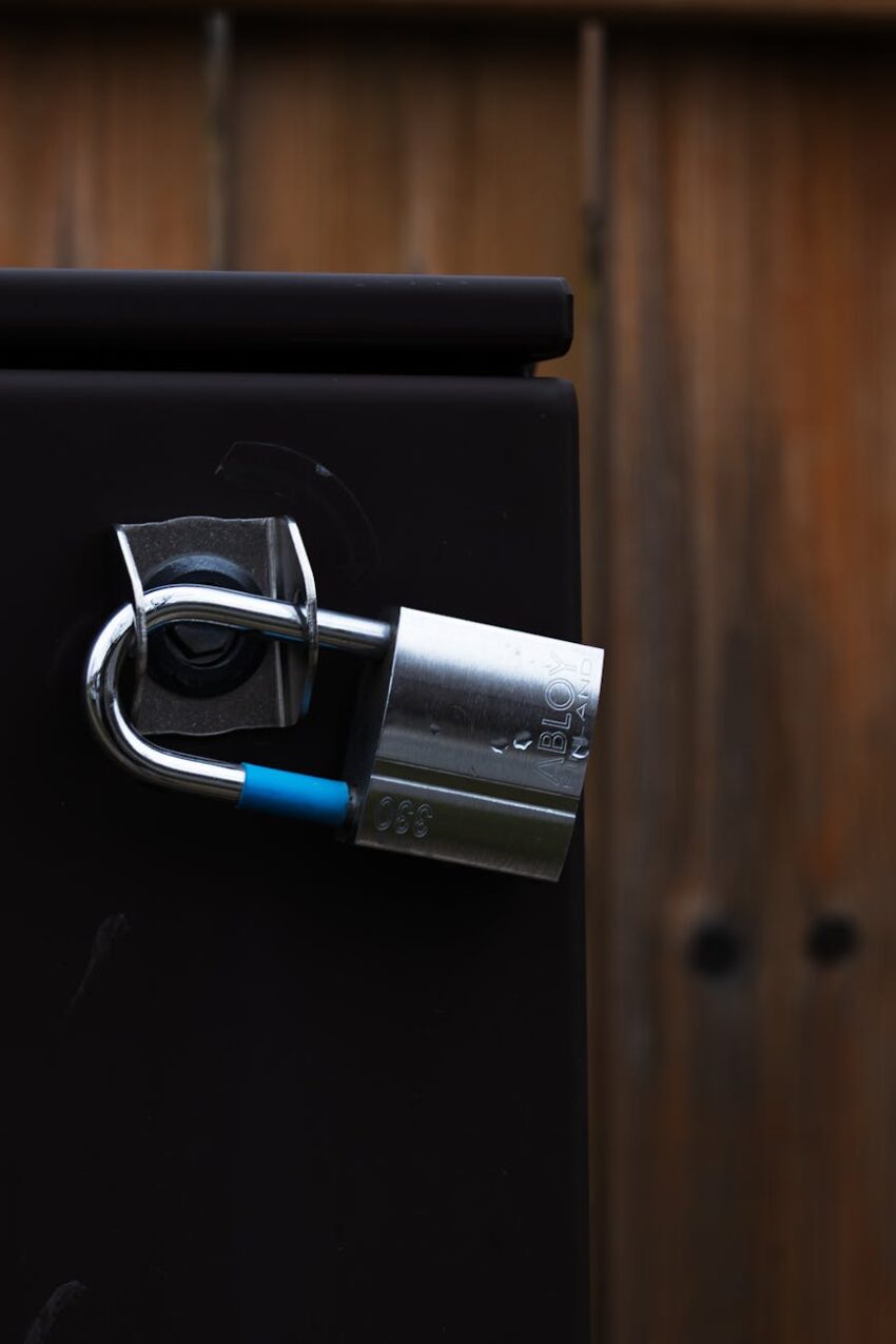 A detailed view of a shiny metal padlock securing a door, symbolizing security and protection.